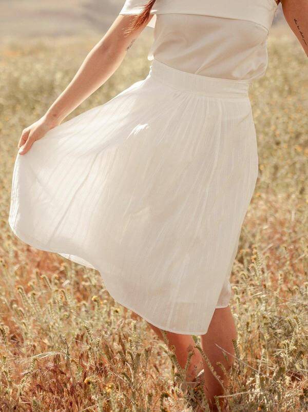 Made Trade Valani white skirt pictured in field