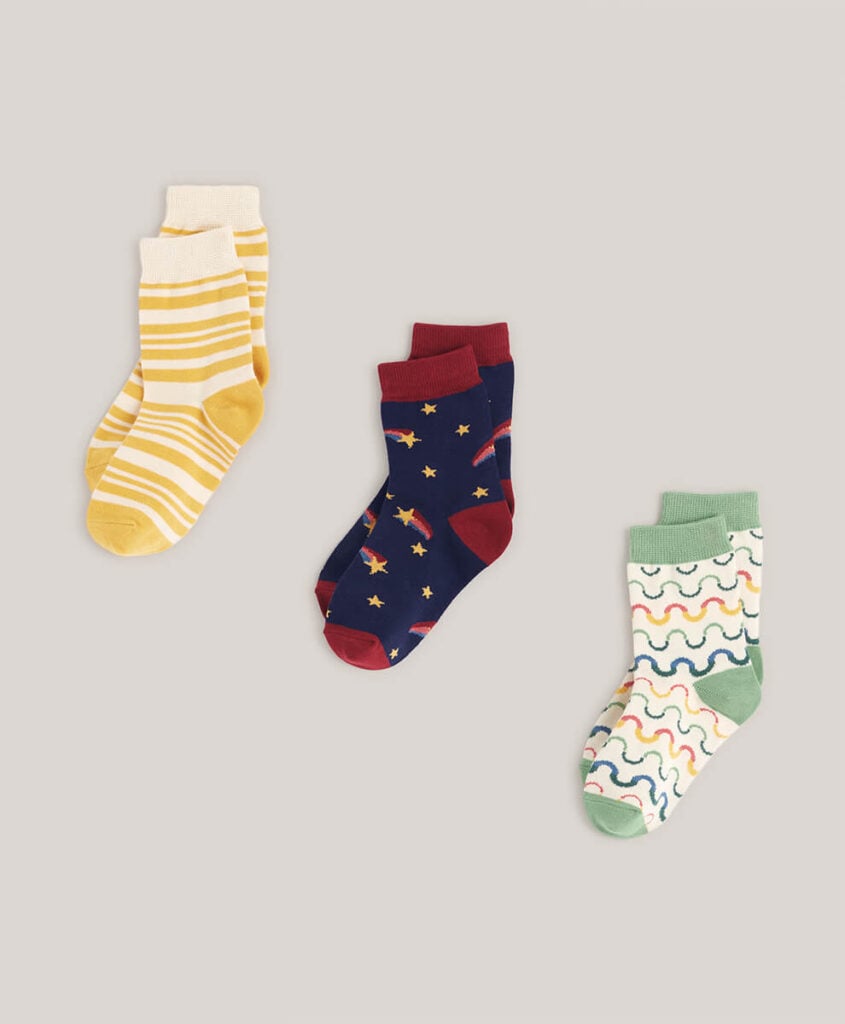 Pact Organic kids socks in three patterns; stripes, shooting stars, and rainbow