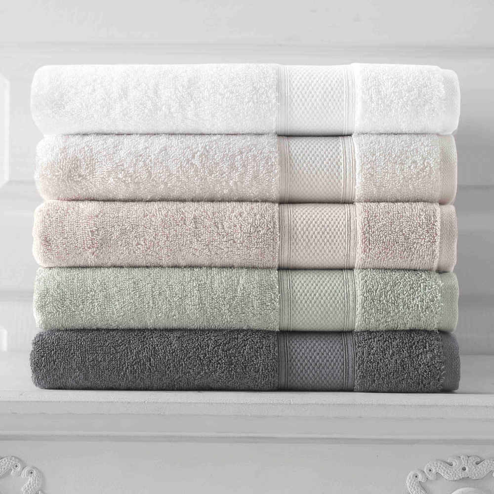 Grund plush organic towels stacked showing different colors available