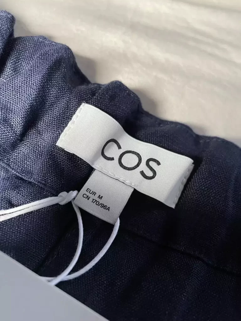 A COS clothing label