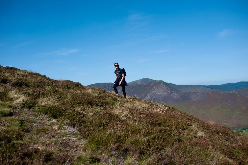 Founder Bethany hiking in hills